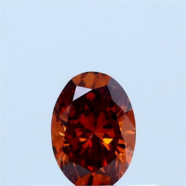 Actual 0.35 carat Fancy Vivid Brownish Orange Oval lab-grown diamond