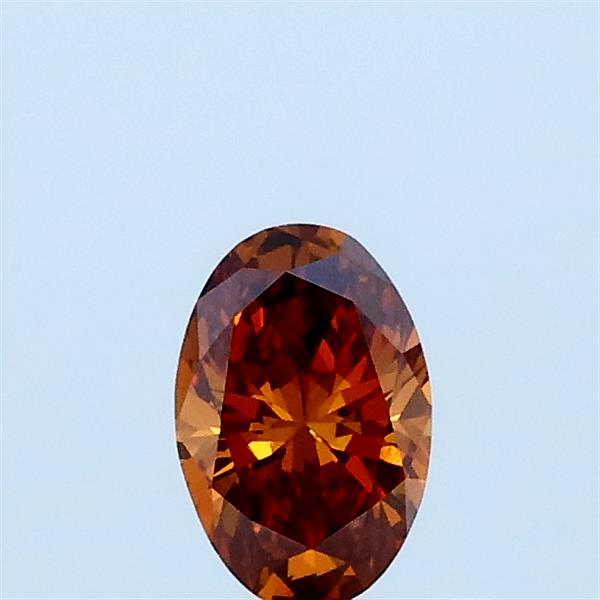 Actual 0.3 carat Fancy Brownish Orange Oval lab-grown diamond