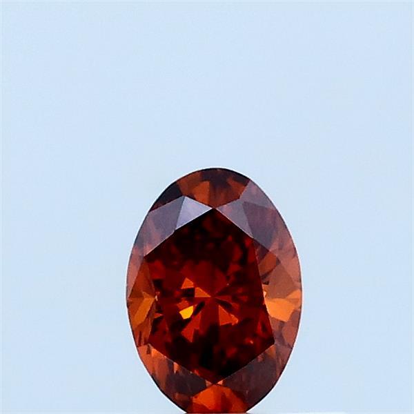 Actual 0.3 carat Fancy Vivid Orange Oval lab-grown diamond