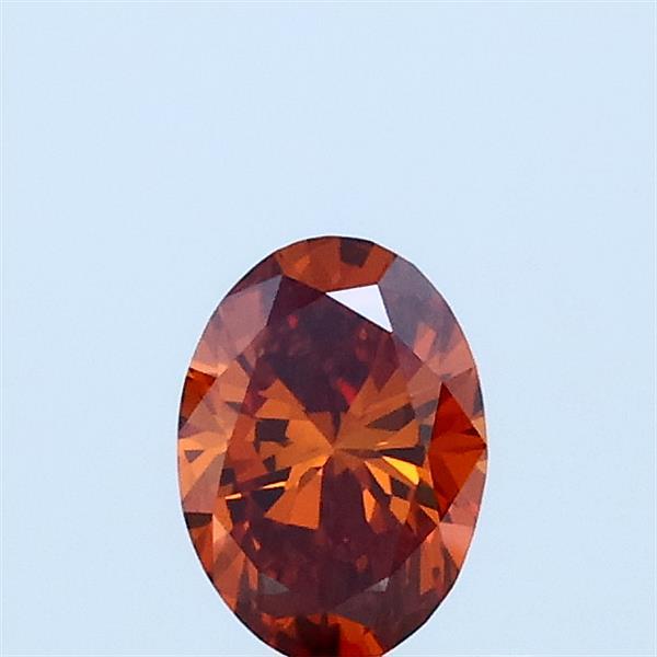 Actual 0.35 carat Fancy Vivid Orange Oval lab-grown diamond