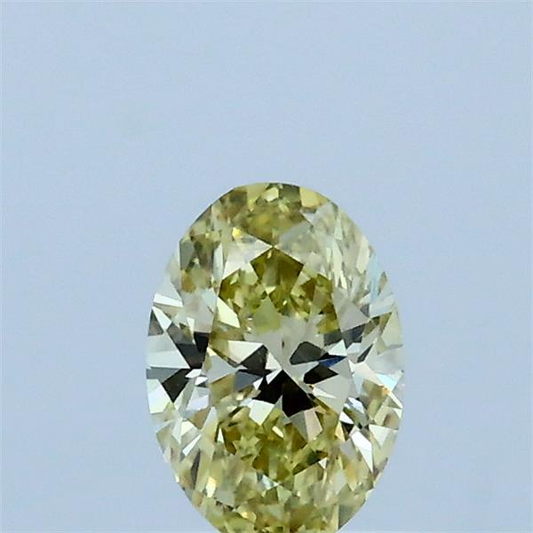Actual 0.4 carat Fancy Yellow Oval lab-grown diamond