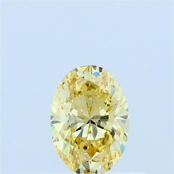 Actual 0.33 carat Fancy Yellow Oval lab-grown diamond