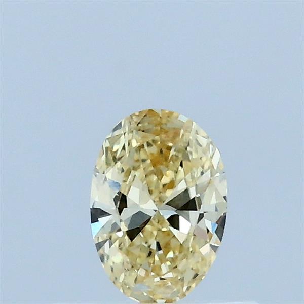 Actual 0.28 carat Fancy Yellow Oval lab-grown diamond
