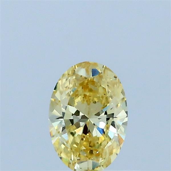 Actual 0.33 carat Fancy Intense Yellow Oval lab-grown diamond