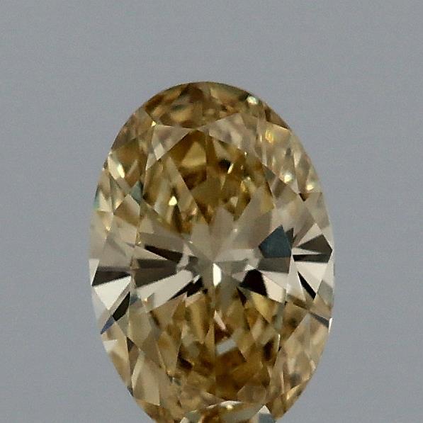 Actual 0.33 carat Fancy Yellow Oval lab-grown diamond